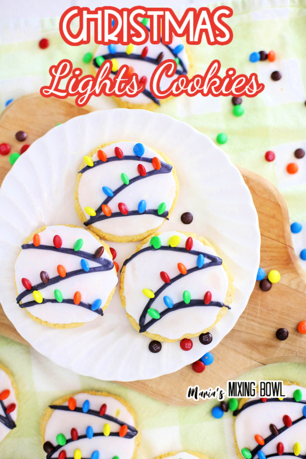 Overhead shot of Christmas lights cookies on white plate