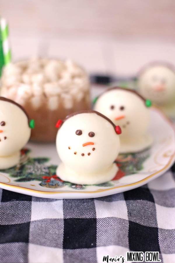 Closeup shot of snowman hot cocoa bombs on plate
