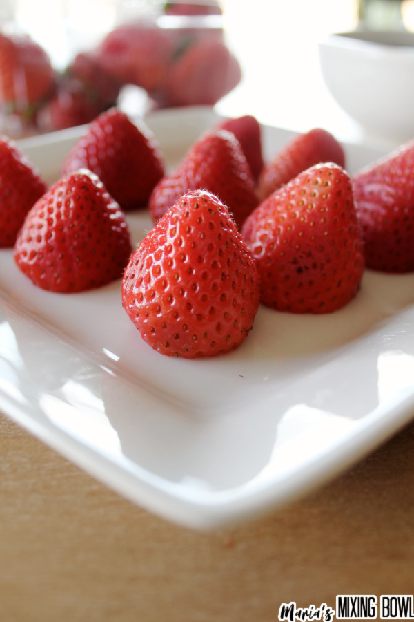 Closeup shot of strawberries standing on white plate
