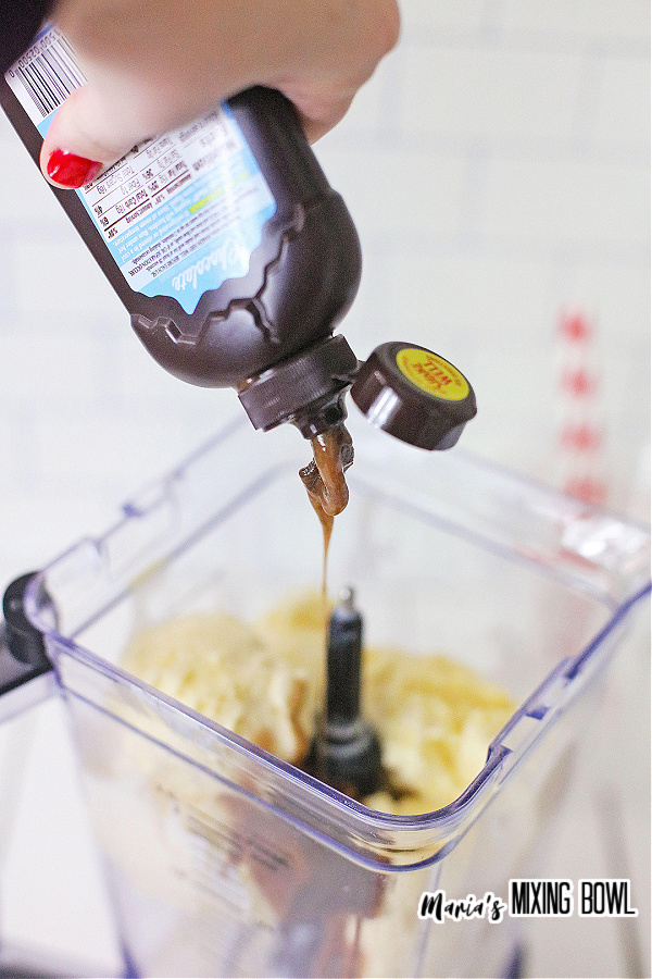 Pouring chocolate sauce into blender