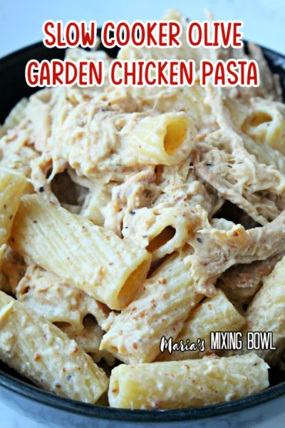 pasta and shredded chicken in a black bowl