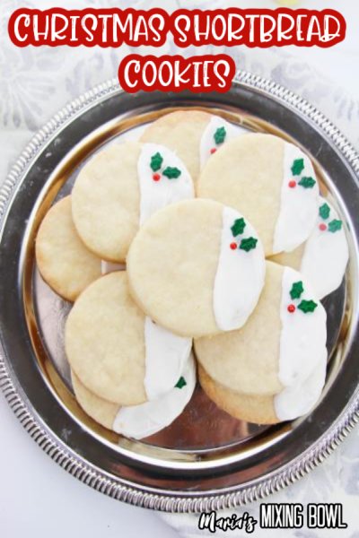 shortbread cookies decorated for Christmas on a serving tray