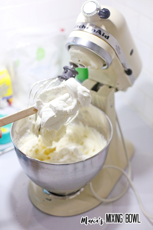 Creating the buttercream frosting in mixing bowl