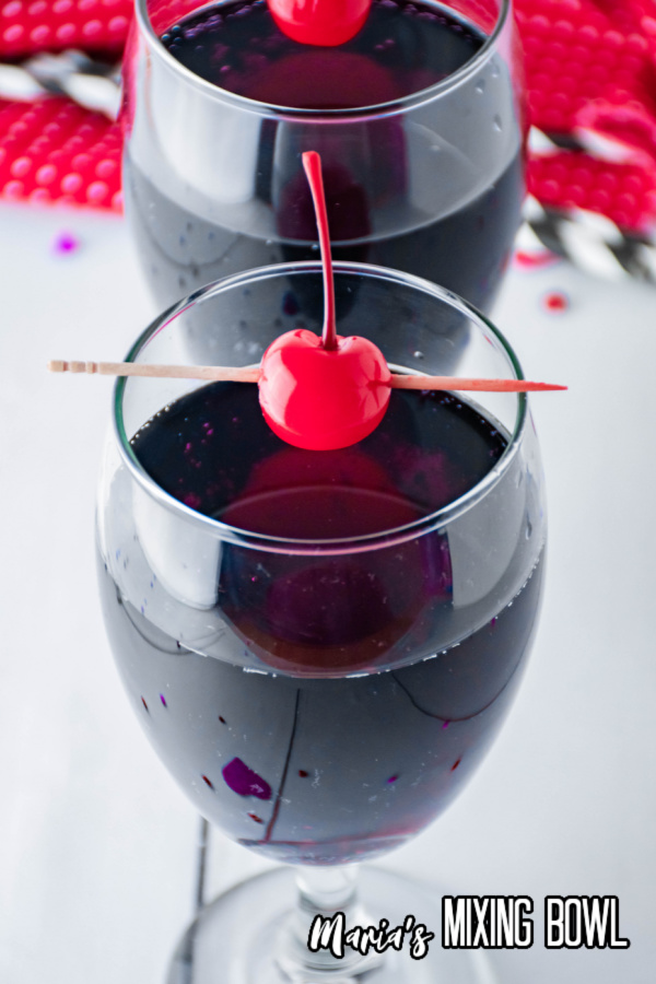 cocktails with cherries and red napkin in background