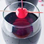 Two Love Potion cocktails with cherries on top