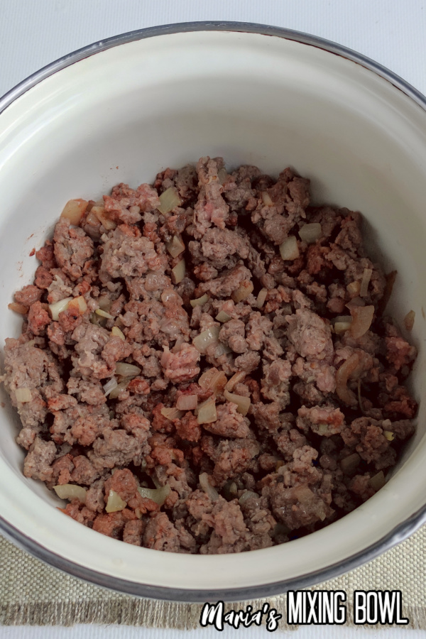 ground beef and onions in pot