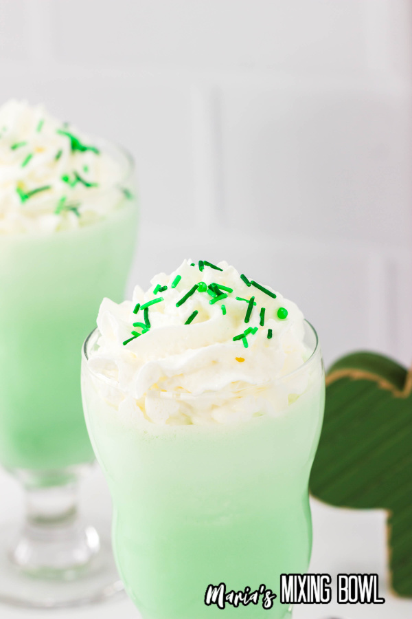 Shamrock shake with whipped topping and sprinkles
