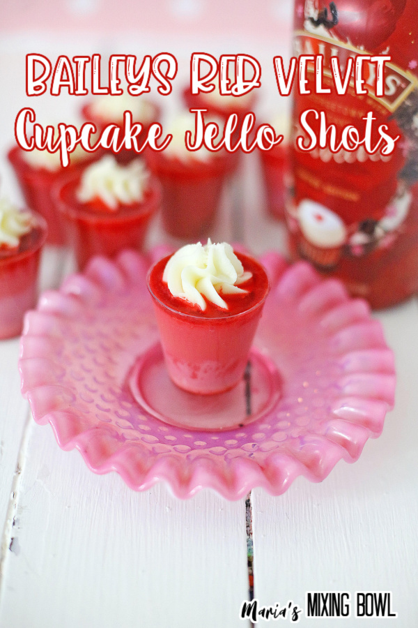 Baileys Red Velvet Cupcake Jello shot on plate with more shots in background