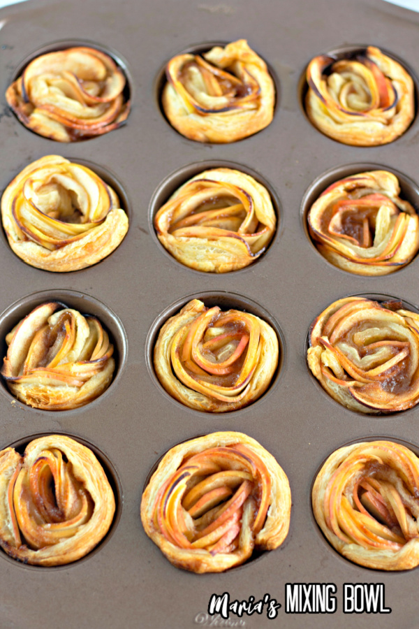 Apple rose tart puff pastries in muffin tin ready to be baked