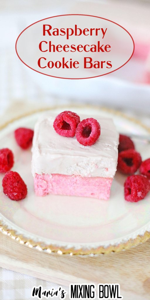 Pink and white Raspberry Cheesecake Cookie Bars on a white Plate placed on a board