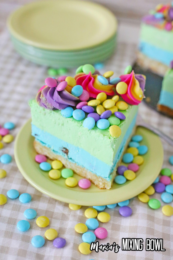 slice of Easter M&M cheesecake on plate