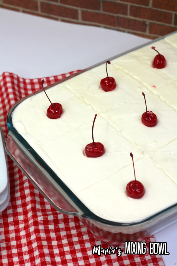 Baking dish with sliced cherry sheet cake