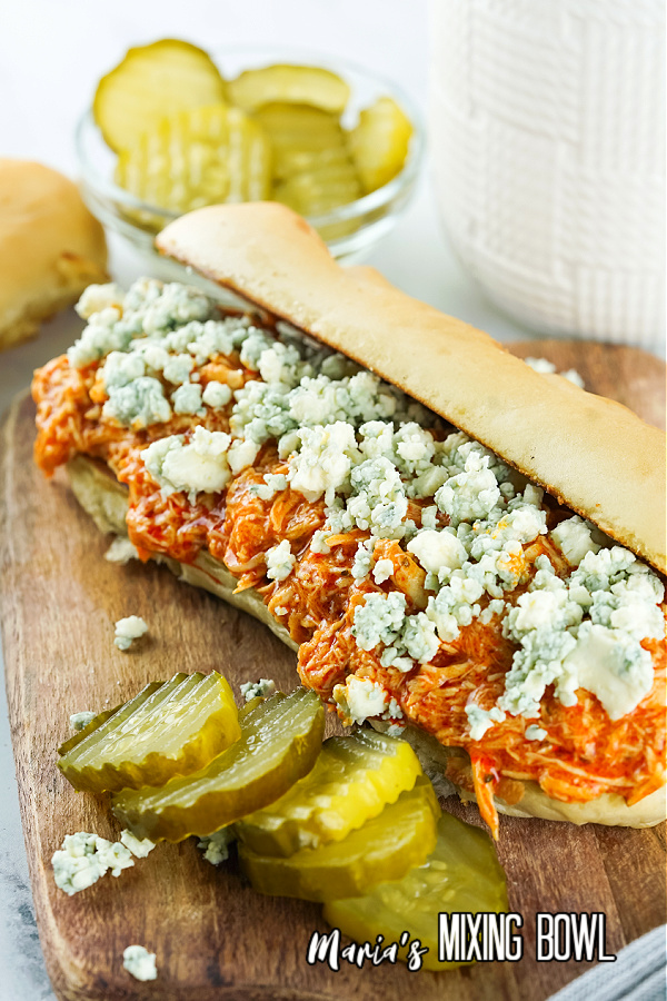 Slow Cooker Buffalo Chicken Cheesesteaks with pickles and blue cheese crumbles
