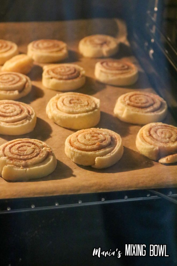 Cinnamon roll cookies baking in oven