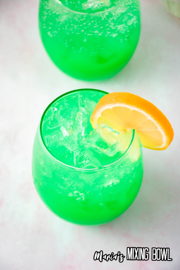 overhead shot of green screwdriver, another drink in background