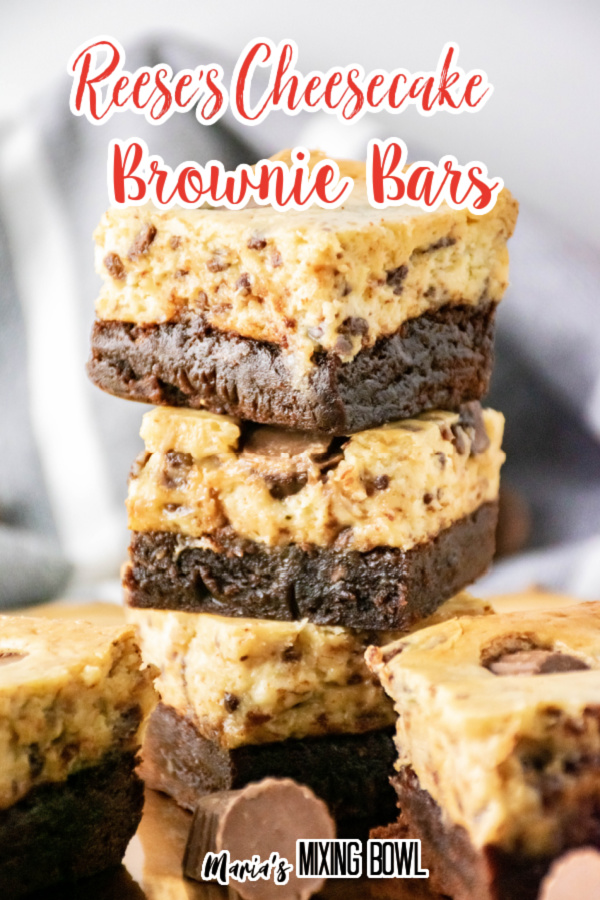 Cheesecake brownie bars stacked atop one another