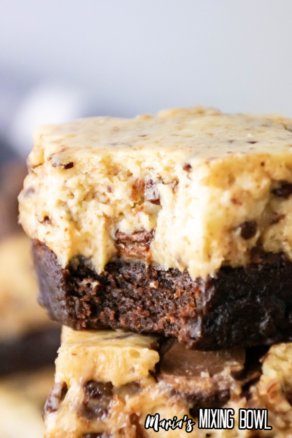 Closeup shot of cheesecake brownie bars stacked atop one another