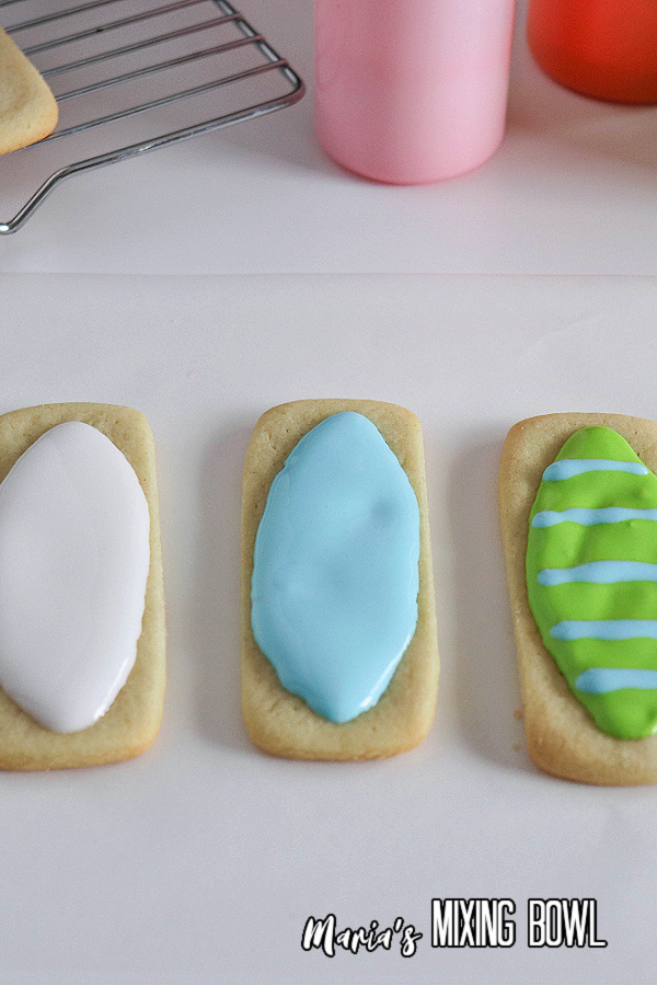 Three sugar cookies topping with icing