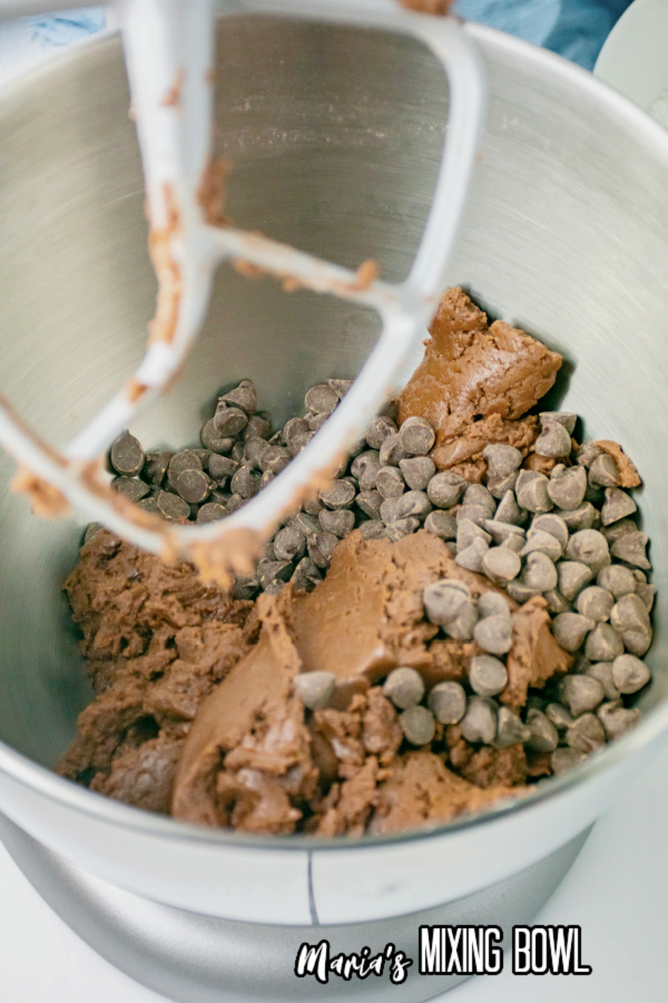 Brownie mix cookie dough with chocolate chips in mixing bowl