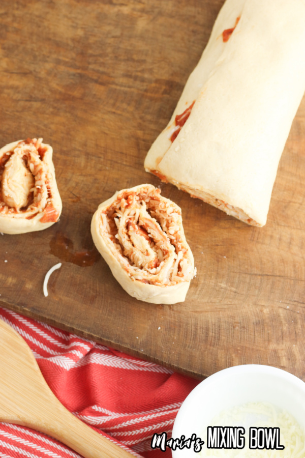 Crescent roll dough rolled up into tube and cut into pepperoni pizza pinwheels