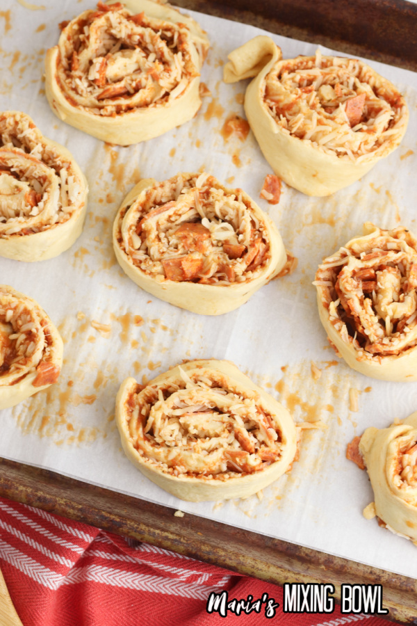 Overhead shot of uncooked pepperoni pizza pinwheels