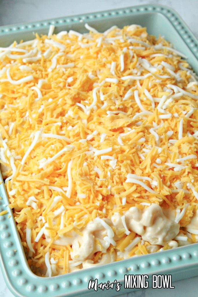 layered Creamy Baked Mac and Cheese in blue baking dish 