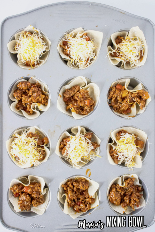 taco cups filled for baking in a muffin pan