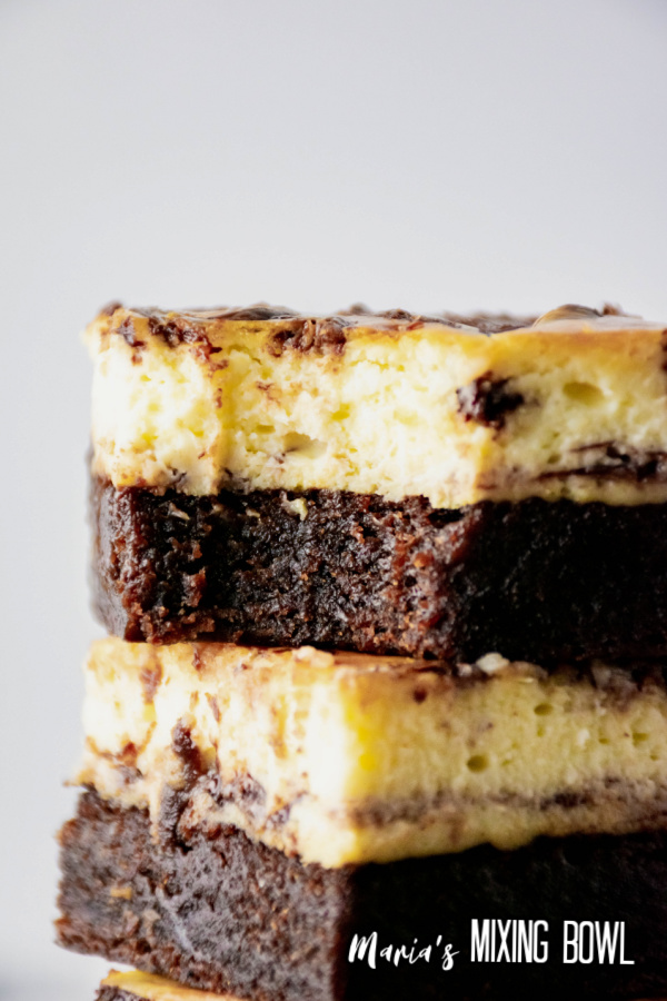 a stack of cheesecake brownies