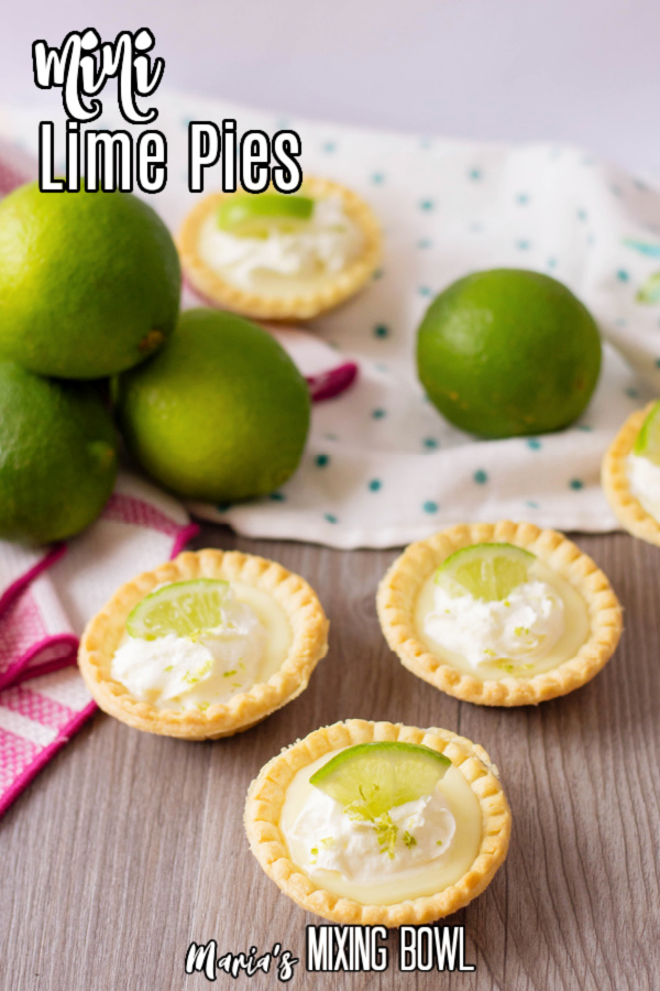 Mni lime pies on table with limes in background
