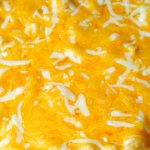 Creamy Baked Mac and Cheese in a blue baking dish