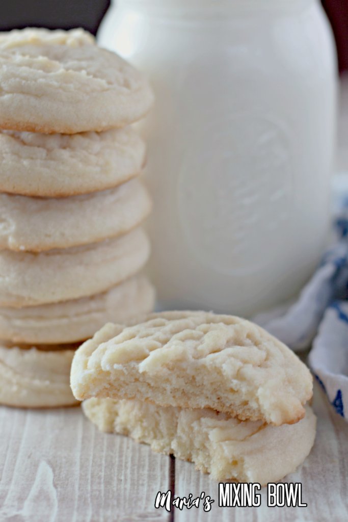 Closeup shot of stack of Amish sugar cookies in front of glass of milk