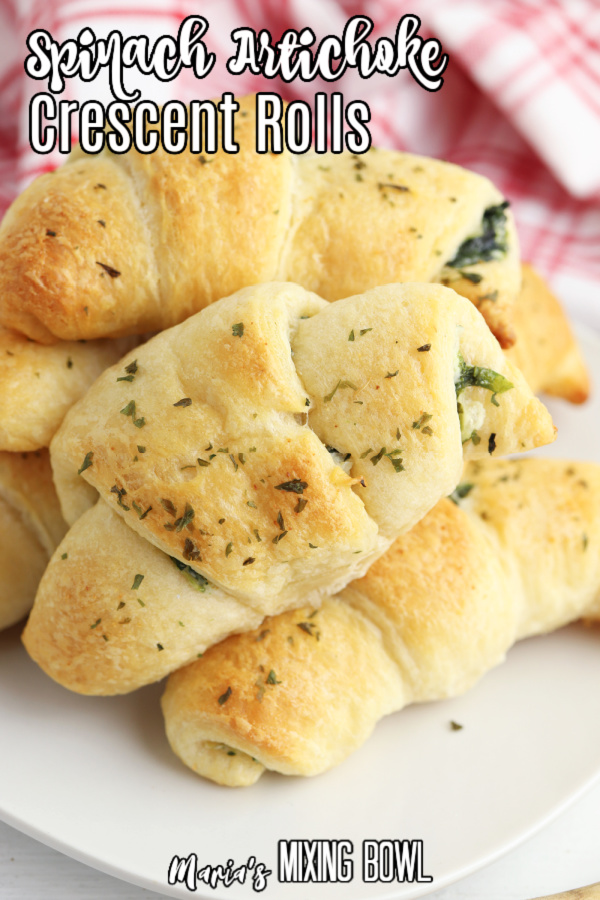 Stack of spinach artichoke crescent rolls on plate