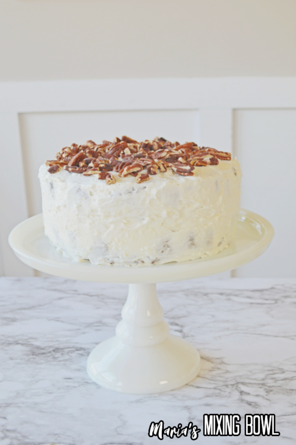 Carrot Cake Recipe on a white cake stand