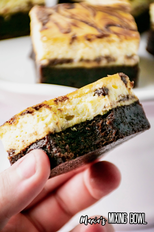 Nutella Cheesecake Brownies with a bite taken from it