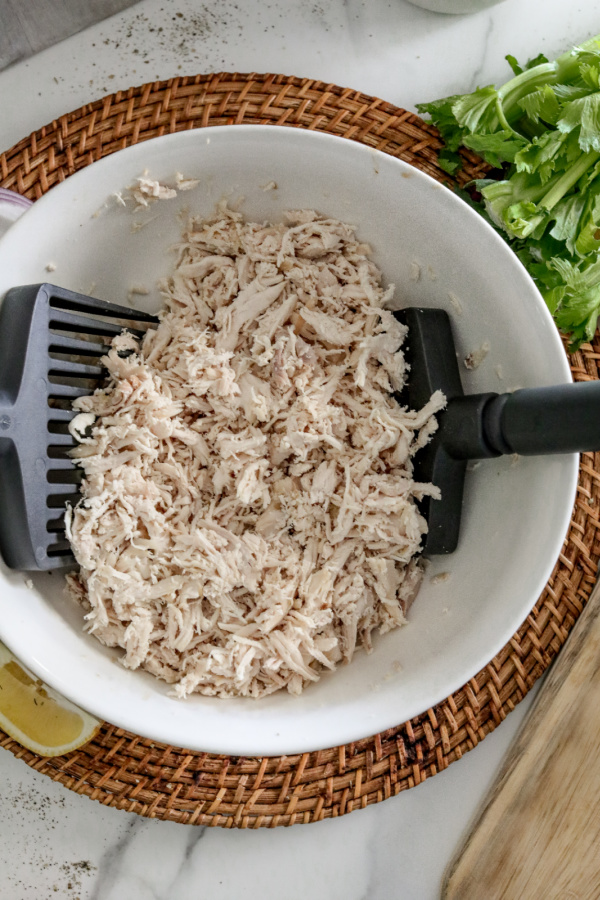 Overhead shot of shredded chicken in bowl