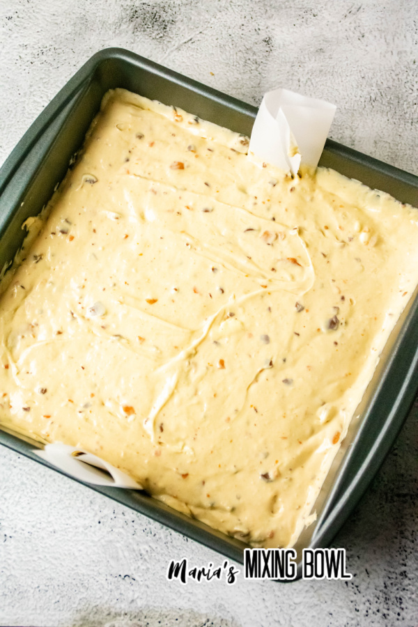 Overehead shot of butterfinger cheesecake batter in baking dish