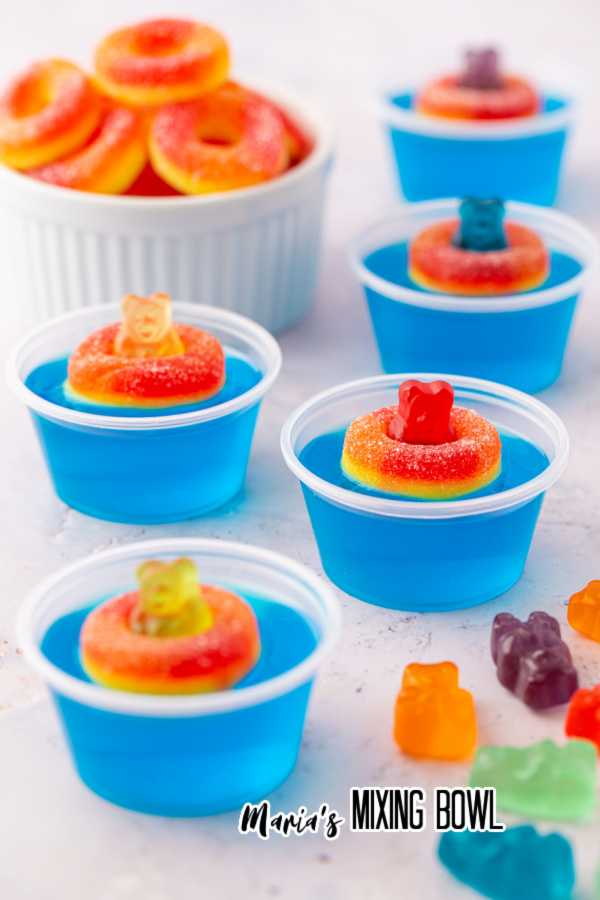Pool Party Jello Shots with peach gummy ring and gummy bears