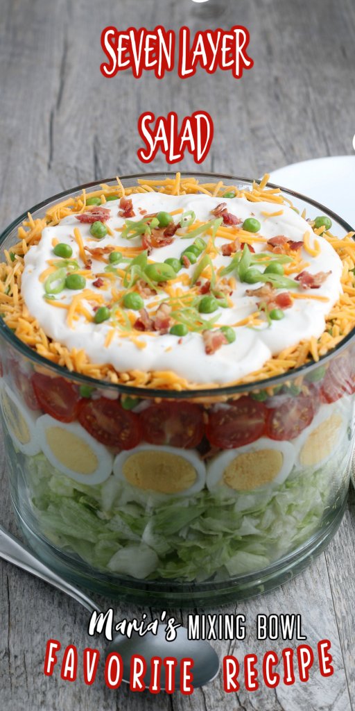 Seven Layer Salad on a grey table with white plates