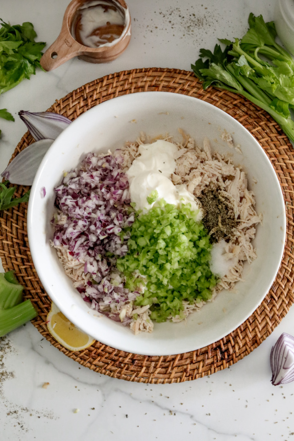 Overhead shot of chicken salad ingredietns in bowl