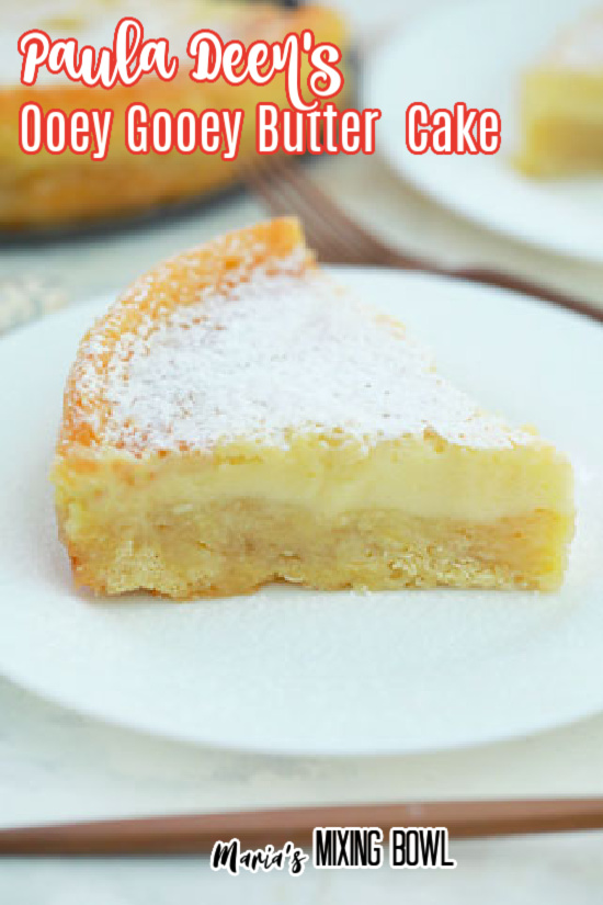 Paula Deen's Ooey Gooey Butter Cake on a white plate with cake in background