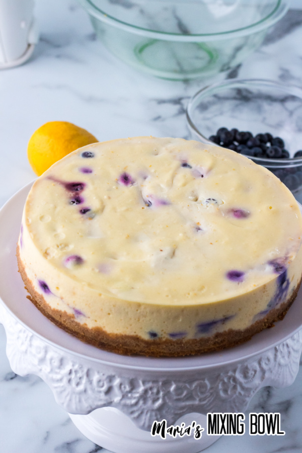 Instant pot lemon blueberry cheesecake on cake dish