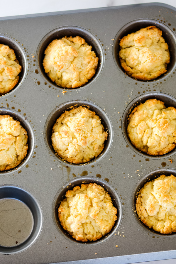 Overehead shot of baked 3 ingredient rolls in muffin tin