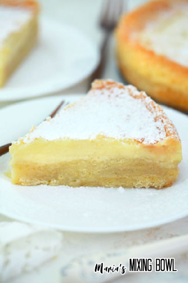 a slice of Paula Deen's Ooey Gooey Butter Cake on a white plate