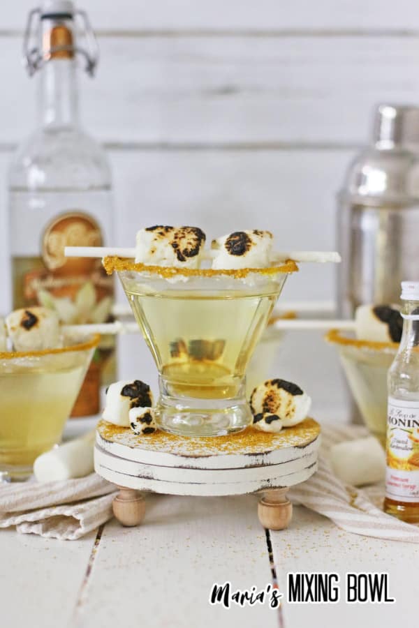 Toasted marshmallow martini with toasted marshmallows next to it