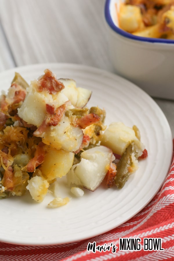 Green Bean and Potatoes on a white plate casserole in background