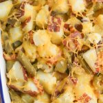 Green Bean and Potato Casserole in a white pan red and white napkin