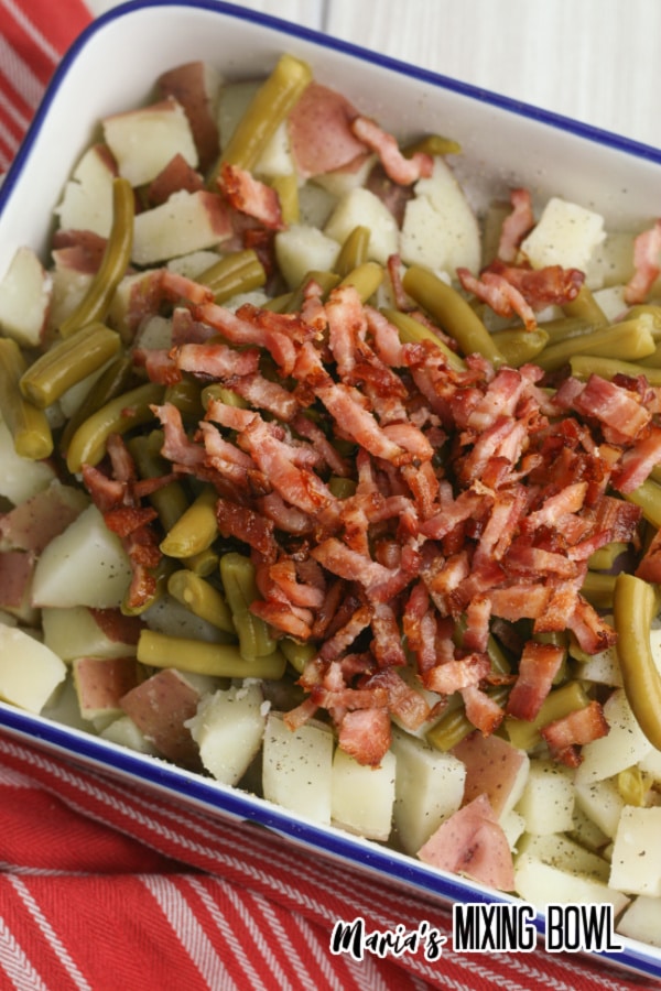 bacon, green beans, potatoes in white pan