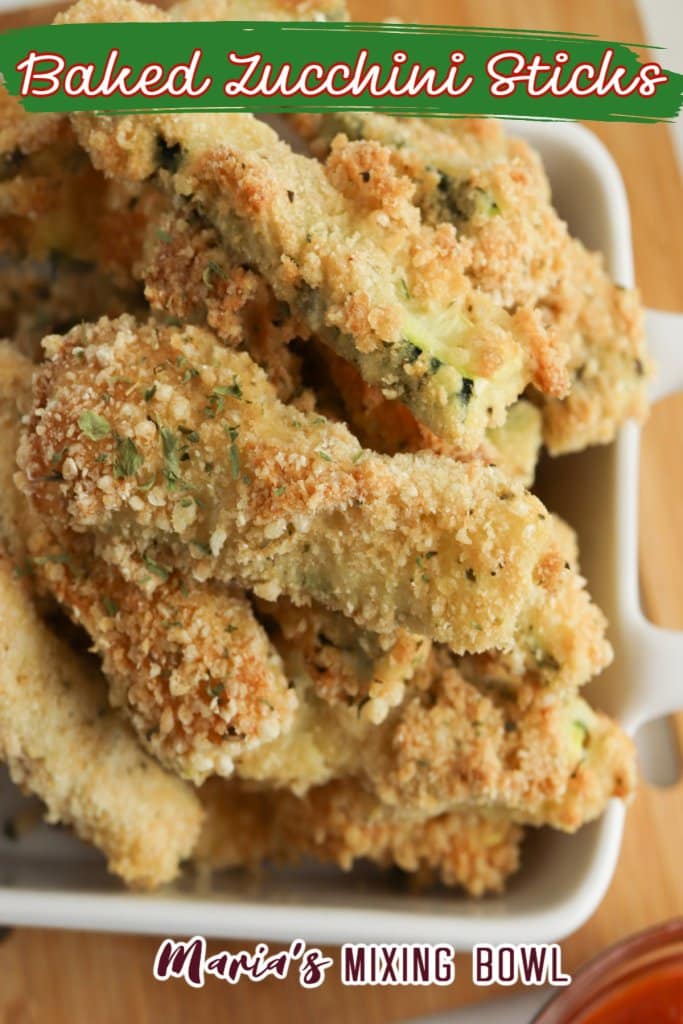 close up image of baked zucchini sticks in a white bowl with text for pinterest