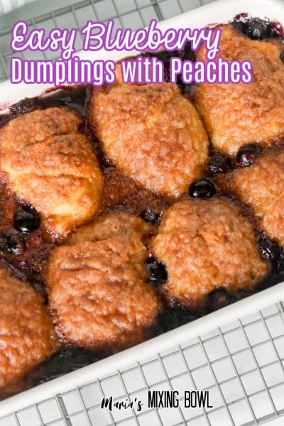 close up of bleuberry dumplings in a baking dish on a cooling rack