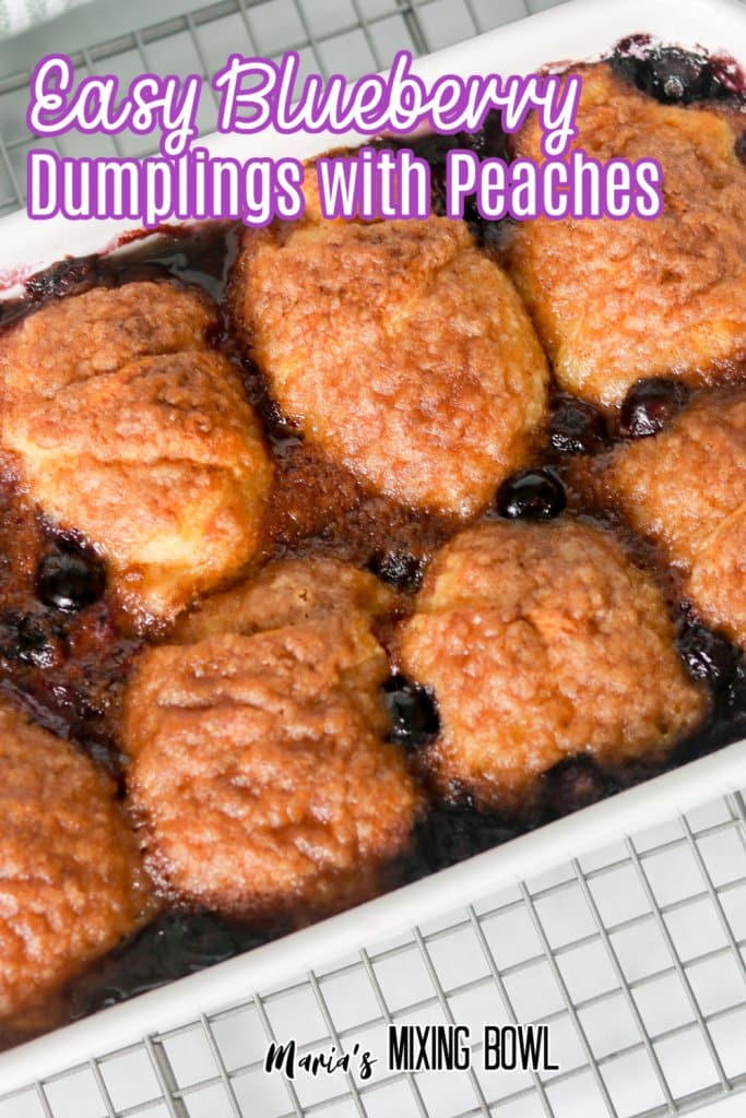 close up of bleuberry dumplings in a baking dish on a cooling rack